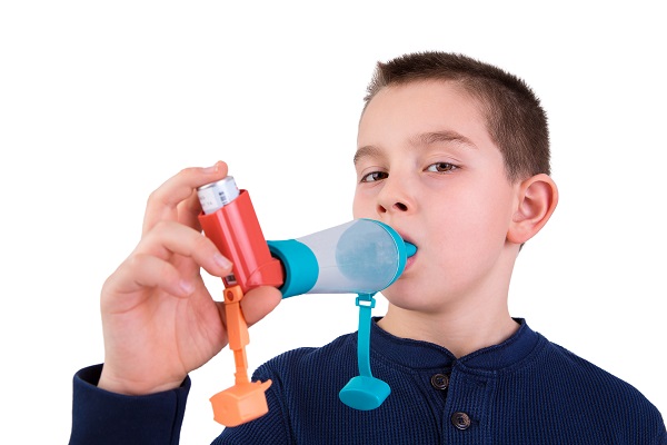 Kid Using Inhaler With Spacer