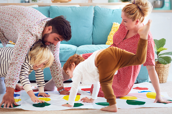 Family playing twister together at home